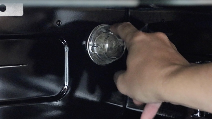 Screw your existing bulb lens cover to the oven